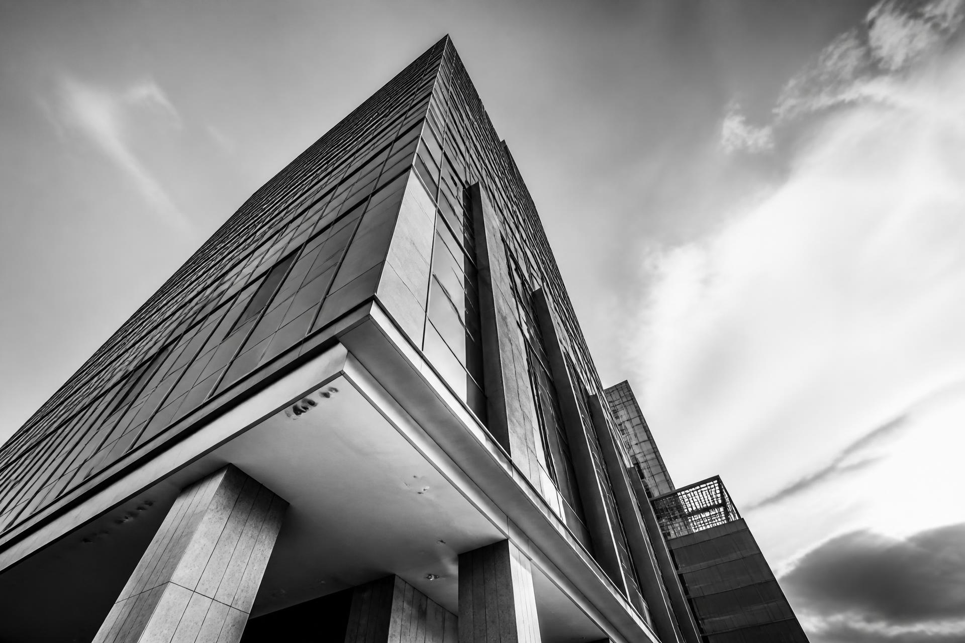 Modern office tower photographed from below